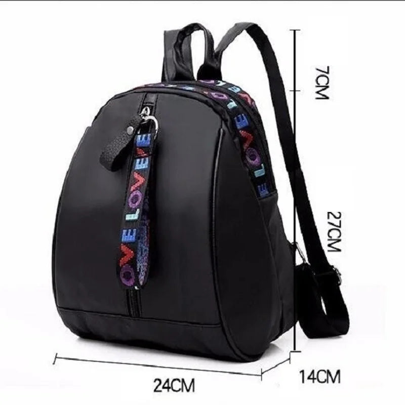 Mini sac à dos pour homme noir en toile, avec bandoulière sportive, idéal pour voyage, école ou usage quotidien.