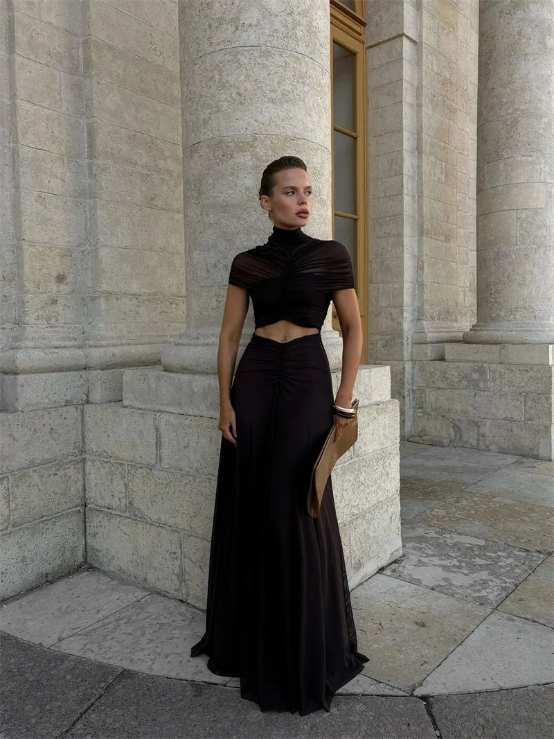 Robe maxi sexy à ajourée, col rond, manches courtes et taille haute, style bodycon, en tissu noir, de la marque Badassmood.