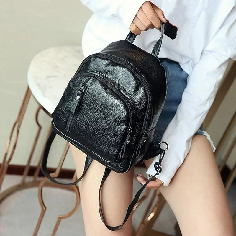 Mini sac à dos pour homme noir en canvas, avec bandoulière sport, idéal pour voyage, école et usage quotidien.