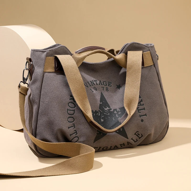 Sac à main femme en toile canvas avec multiples poches et trois modes de port, grande capacité, style pratique et moderne.