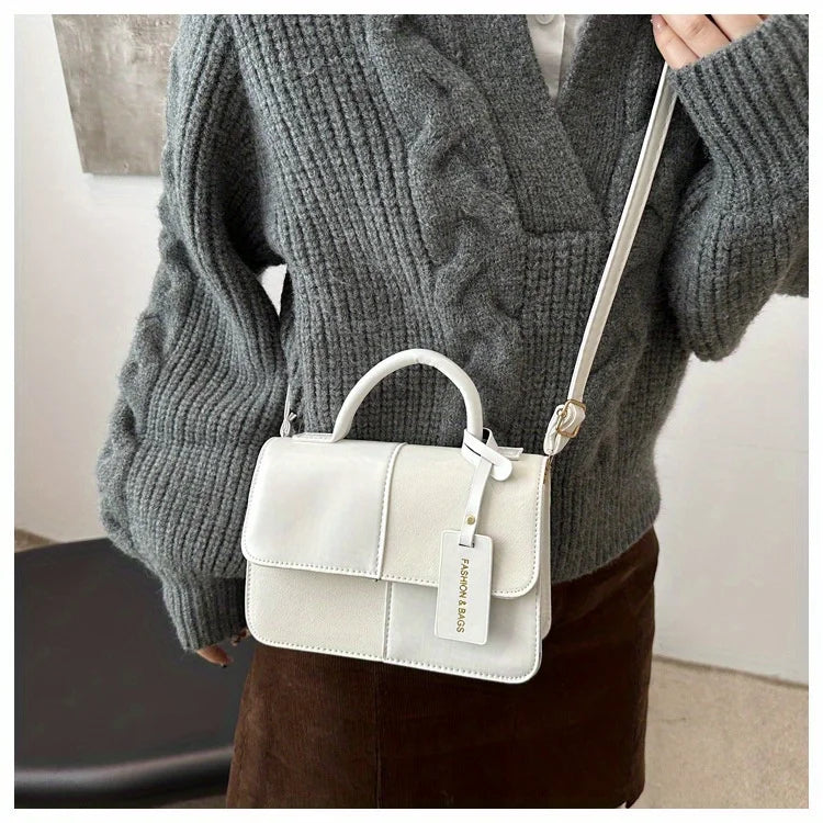 Sac à main femme géométrique avec bandoulière élégante, design moderne pour un style quotidiens mode.