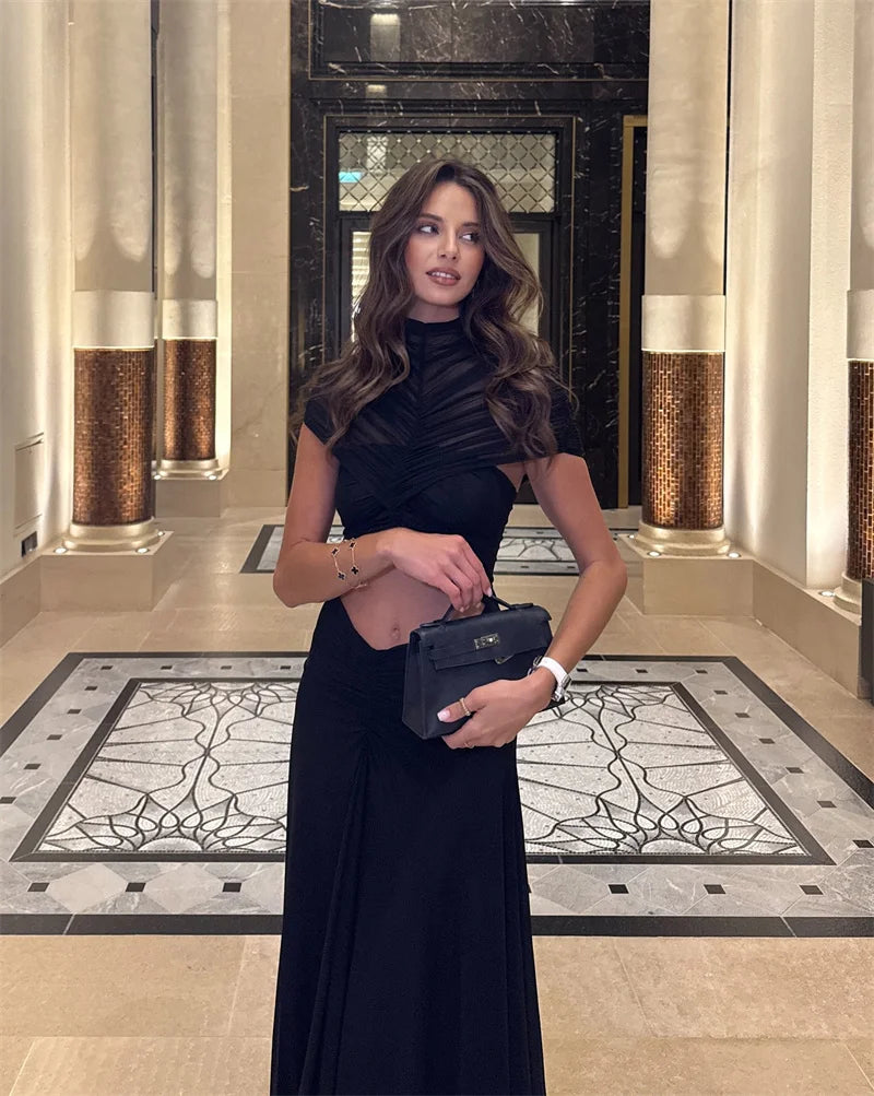 Robe maxi sexy ajourée à col rond, manches courtes, taille haute, style bodycon, en tissu noir, par badassmood.com
