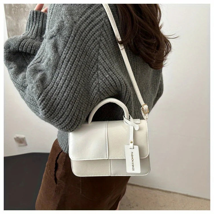 Sac à main femme géométrique avec bandoulière élégante, style mode quotidien, en design moderne et tendance.